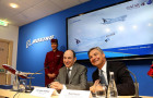 CEO of Qatar Airways, Akbar Al Baker announcing the largest single aircraft order in the airline's history, alongside Ray Conner, Boeing Commercial Airplanes President and CEO.