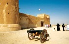 Tourists visit Al Zubara fort, one of Qatar’s tourist sites. Qatar is seeking to promote itself as a travel destination through a tourism satellite account. (Image Corbis)